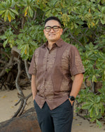 Pūpū‘ala cone shell Aloha Shirt on model